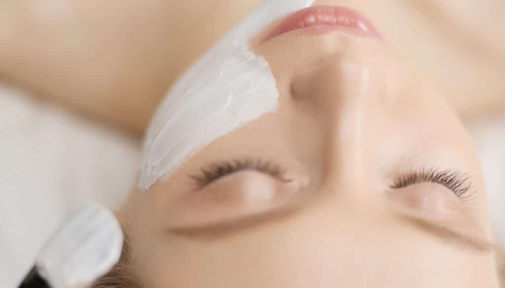 woman receiving chemical peel treatment