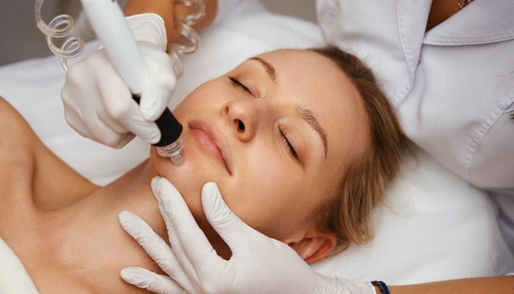 woman receiving medical facial treatment